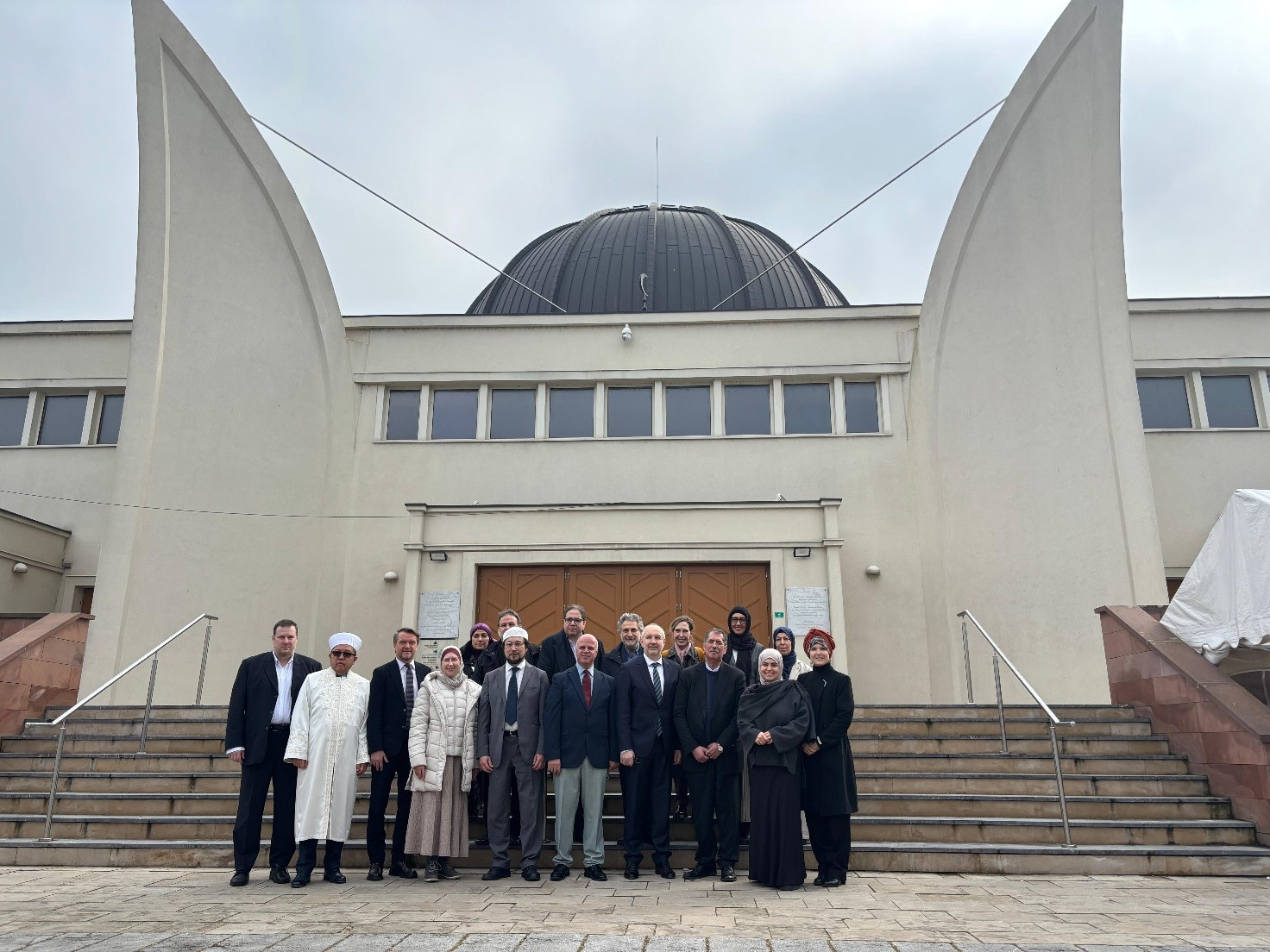 EULEMA members and Council of Europe representatives standing in front of the Grand Mosque of Strasbourg